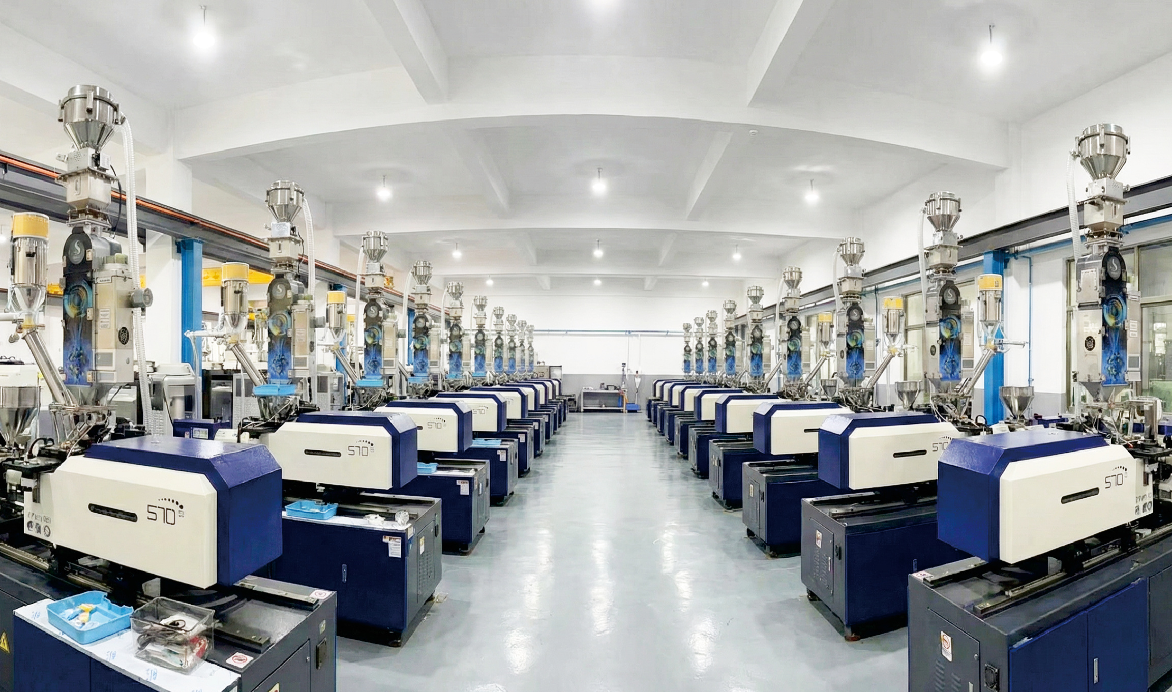 MegaColor color powder dosing machines installed in a customer's injection moulding workshop