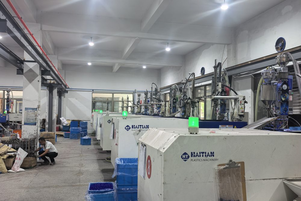 A fully fitted line: one dosing machine at the hopper of every moulding machine