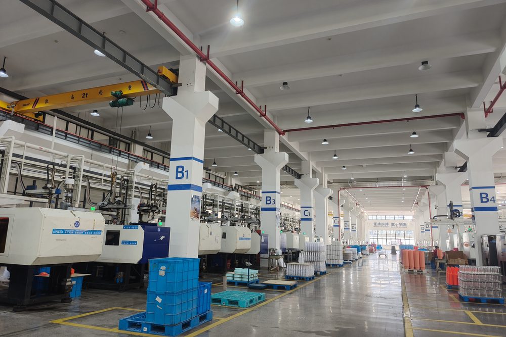 Preform hall: drying and conveying lines run above the machines